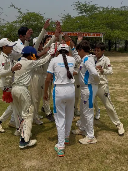 The team breaks the huddle with a cheer, ready to defend their total.