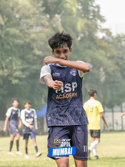 A player celebrates a goal, showing the passion and joy that fuels our academy.