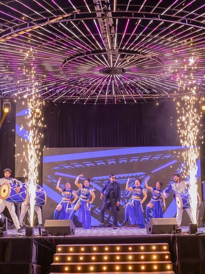 A high-energy group performance with dhol players and dancers, all framed by our impressive stage and lighting setup.