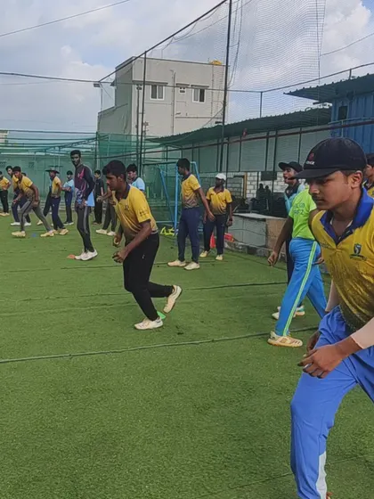 Players engaged in dynamic warm-up exercises. Every training session starts with drills that improve mobility, agility, and prepare the body for intense cricketing action.