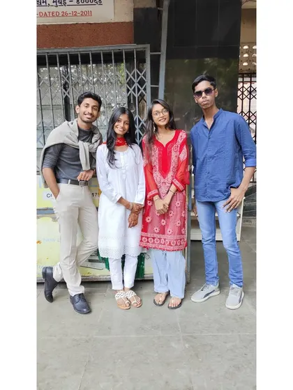 Students dressed up for Bollywood Day, posing for a photo outside our classes.
