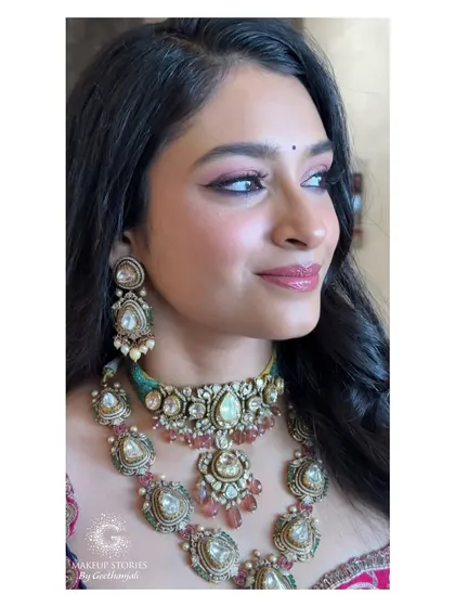A profile shot of Mithila's reception makeup. This showcases the winged eyeliner and soft blending of the eyeshadow, key skills for a polished look.