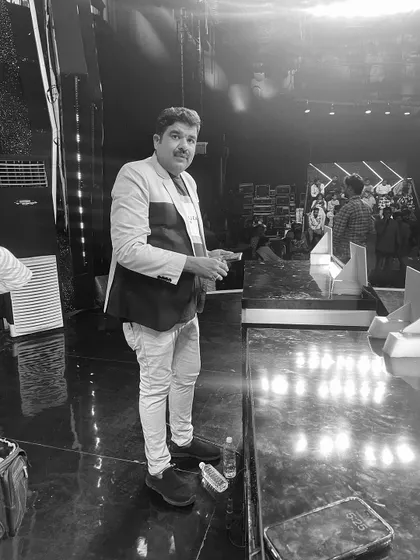 A candid shot on the sets of a Star Suvarna show.
