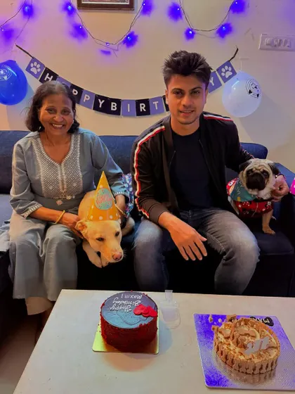 A beautiful family portrait celebrating their two dogs. We offer different cakes and treats so you can get something unique for each of your furry family members.