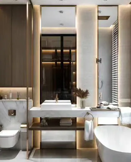 A luxurious master bathroom with a freestanding tub, a large vanity with backlit mirrors, and a view into the walk-in closet.