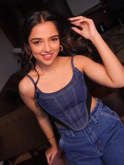A classic denim on denim look for Ahsaas Channa. The corset style top adds a modern twist to the timeless Canadian tuxedo, perfect for a casual and cool photoshoot.