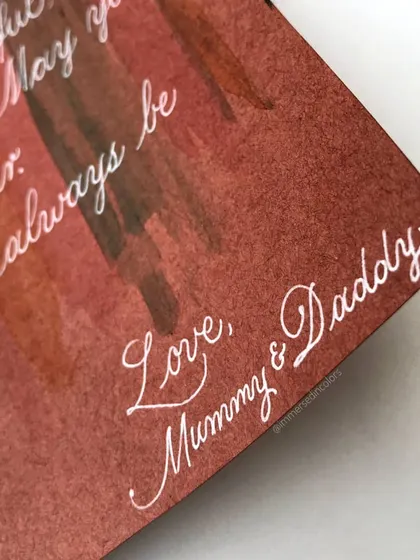 A close-up of the handwritten message inside the custom birthday card. I love using white ink on a colored background for a soft, dreamy effect.