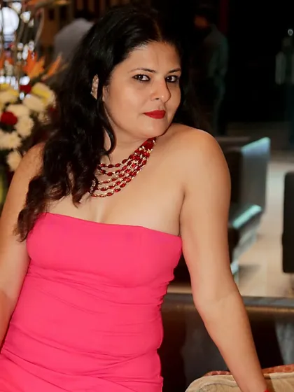 A bright pink off-shoulder bodycon dress. This is a statement piece that needs minimal accessories, just a bold necklace and confidence.