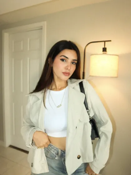 A close-up of the cropped trench jacket outfit, showing the details.