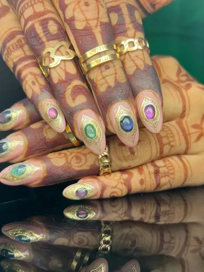 Another view of the incredible gemstone nail art, showcasing the detail and artistry.