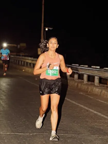 Focused and determined on a dark road during an ultra marathon. My coaching prepares you for the mental and physical challenges of running for hours on end.