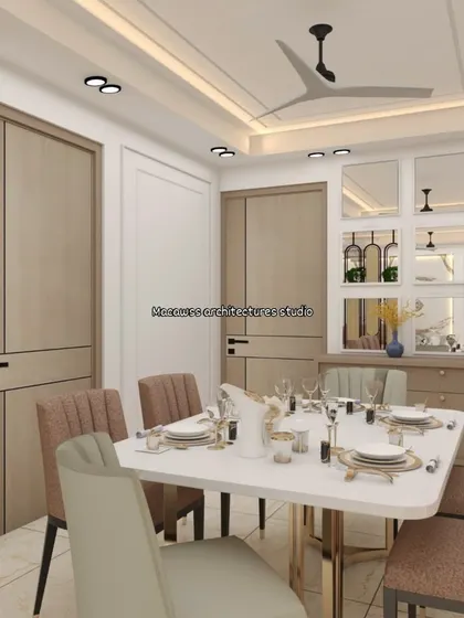 This dining area features a custom crockery unit with mirrored panels to make the space feel larger and brighter. The combination of light wood tones and white creates a fresh and contemporary dining environment.