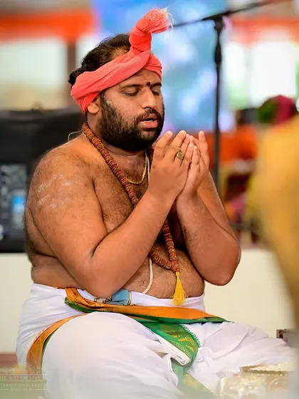 A priest deeply absorbed in prayer during the Shat Chandi Homa. The expertise and devotion of our pandits, trained in our own Veda schools, make these ceremonies authentic and powerful.