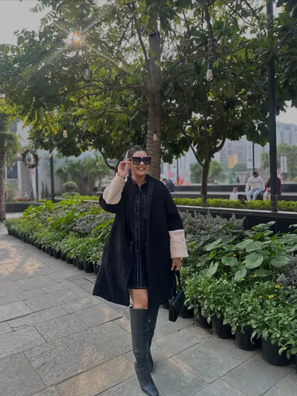 The sun hitting this black teddy coat, showing off its texture.