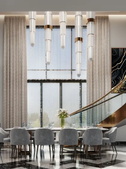 A design concept for a grand dining area set below a spiral staircase. The black and white patterned marble floor and modern chandeliers create a truly opulent setting.