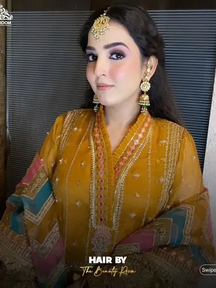 A front view of the hairstyle, showing how it complements the overall makeup and outfit.
