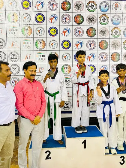Dhairya with his silver medal at the Delhi State Championship. We celebrate every victory as a team.