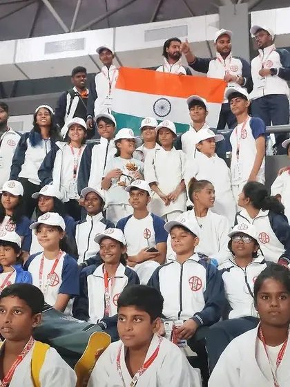 Our team in the stands, proudly holding the Indian flag. We were there to cheer on every single one of our teammates.