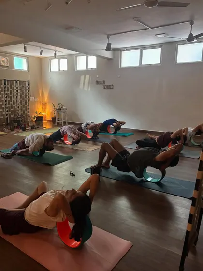 Students using props during a class at the shala. The space is equipped to support practitioners of all levels on their journey.