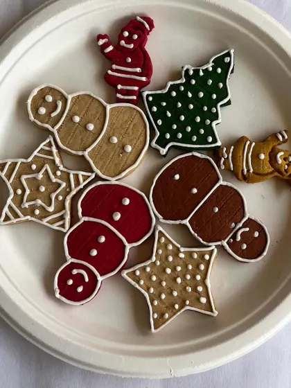A delightful assortment of our handmade Christmas cookies. Featuring snowmen, stars, and Christmas trees, these are perfect for a festive snack or gift.
