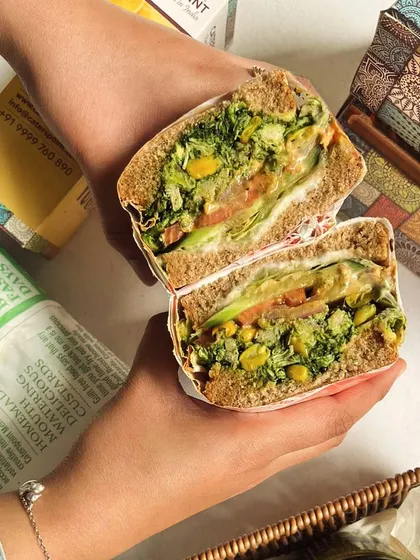 Our Corn Cheese Sarson Da Saag Sandwich is a new festival season launch. It's an innovative fusion of traditional saag with corn and cheese, creating a unique and delicious sandwich.