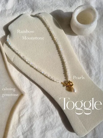 Another view of the Rainbow Moonstone toggle necklace with its pearl detail. It's a stone for balance, harmony, and hope.
