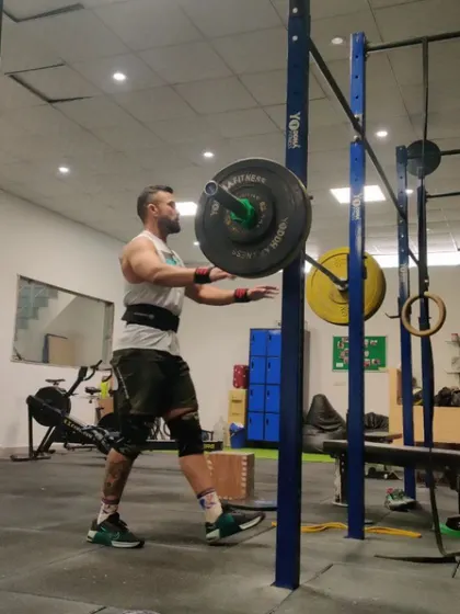 A power snatch in motion. This lift is one of the most technical movements we do, requiring speed, coordination, and mobility.