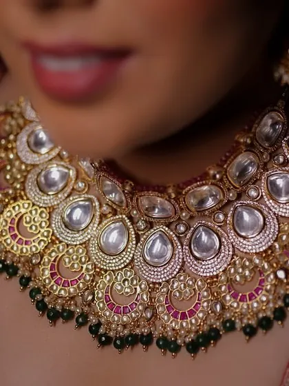 A detailed close-up of the bride's magnificent Kundan and Polki necklace, showcasing the exquisite craftsmanship of her bridal jewelry.