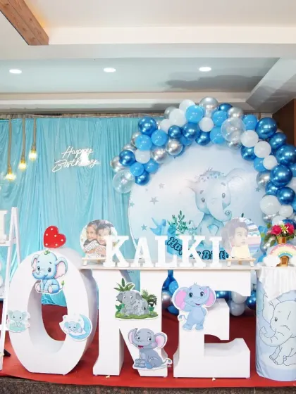 We bring your child's favorite themes to life with meticulous detail. This elephant-themed first birthday party includes a custom backdrop, large character cutouts, personalized "ONE" lettering, and a coordinated balloon arch for a picture-perfect celebration.