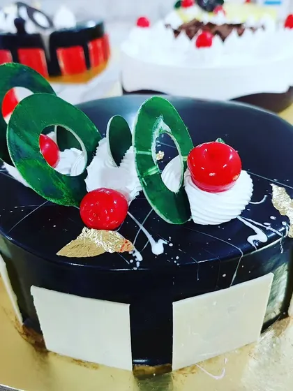 A beautiful chocolate mirror glaze cake from our professional course. You will learn the technique to achieve this flawless, shiny finish.
