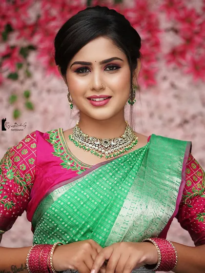 A smiling portrait of the model, showcasing the beautiful, professionally-applied makeup.
