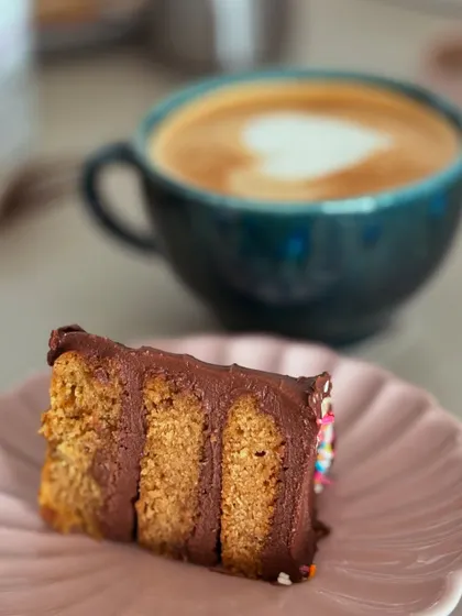 A slice of our delicious Symphony Chocolate Cake is the perfect companion for a coffee break. It's a simple pleasure that we enjoy right here at our TCP headquarters.