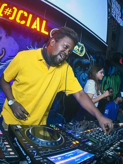 Bobkat on the decks, with the iconic graffiti wall of Khar Social behind him.
