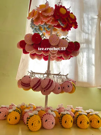 Another angle of my keychain collection, showing the different tiers of flower, strawberry, and bee charms ready for a bulk order.