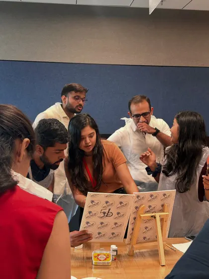 A candid shot of a team discussing their creative approach. These workshops open up new lines of communication and collaboration.