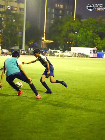 A defender closes down an attacker, showcasing the competitive nature of our 1v1 drills.