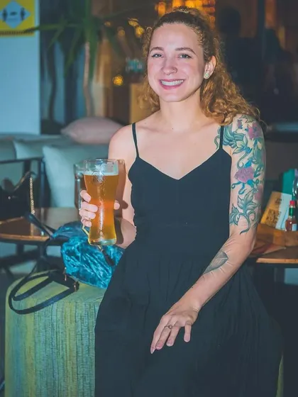 A guest enjoying a beer at the Christmas party.