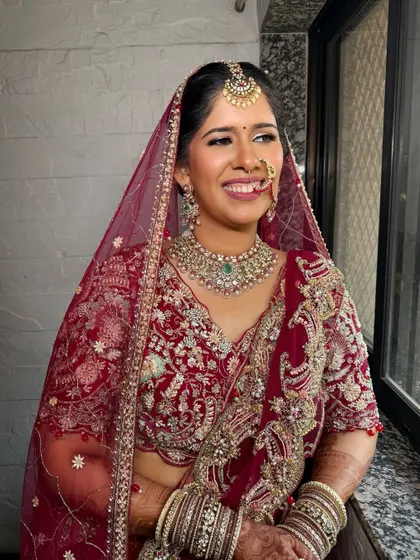 This bride is glowing by the window light. Natural light is the best test for makeup, and this look is blended to perfection.