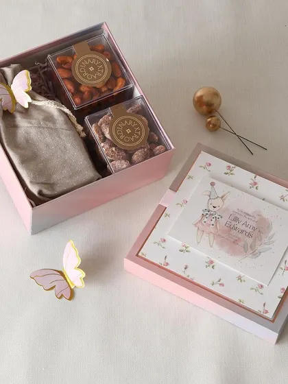 A premium return favor hamper featuring our delicious flavored nuts and decadent chocolate clusters, perfect for any special occasion.