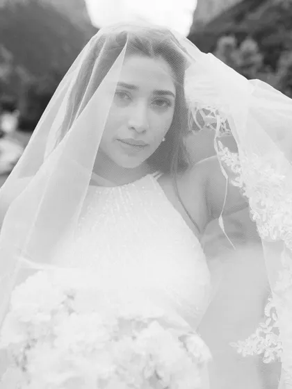 A soft and ethereal black and white close-up of Punar, with her veil creating a dreamy filter. This is a beautifully romantic and artistic bridal portrait.