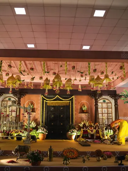 This shot captures the full expanse of the traditional stage we designed. Every element, from the carved wooden pillars to the brass artifacts, was carefully chosen to contribute to the nostalgic and culturally rich atmosphere.