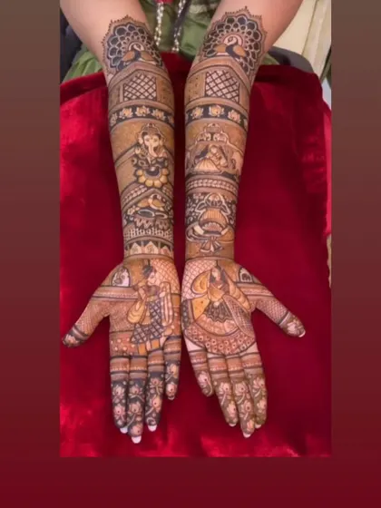A complete bridal story with portraits on the palms, Ganesha and peacock figures on the arms, and intricate patterns filling the space.