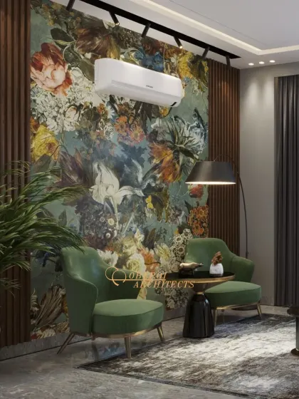 The statement floral wallpaper is the hero of this space, complemented by deep green velvet chairs and a modern arc lamp.