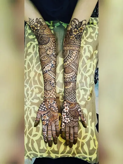 A beautiful, symmetrical full-arm design. I love creating patterns that mirror each other on both hands while still having unique elements.