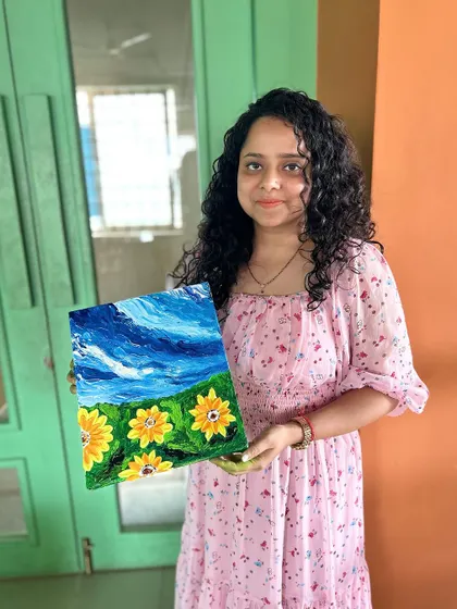 This participant is so happy with the vibrant sunflower field painting she created. My knife and finger painting workshops are a great way to loosen up and create expressive, textured art.