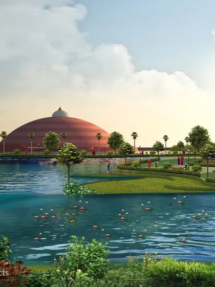 A view across the man-made lake towards the Dhamma Pavilion. The water body is not just aesthetic but also helps create a cooler microclimate for the campus.