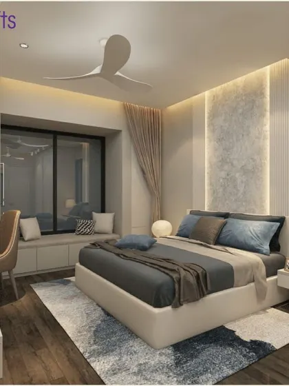 A serene and minimalist bedroom from our 'Konark Splendor' project. The room features a cozy window seat, a floating desk, and a neutral color palette for a calming atmosphere.