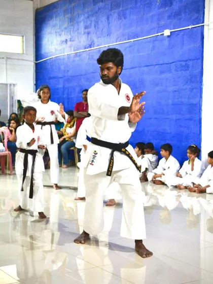 I lead a class, demonstrating a blocking technique. Teaching is an emotional connection, as we are entrusted with helping parents protect their children's futures.