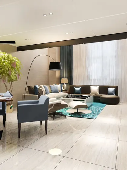 An expansive open-concept living and dining area with polished tile flooring and contemporary furniture, designed for a luxurious and spacious feel.