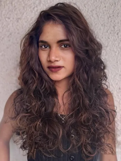 A portrait of the mocha-toned curly hair, showcasing the soft, defined curls and the beautiful color blend.